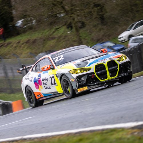 A car on the racetrack at British Racing Greats, a fundraising and awareness event celebrating the greatest racing games ever made and raising money for Solving Kids' Cancer UK.