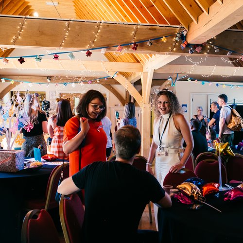 Family Support worker Vicky speaking with parents at the Family Fun Day event