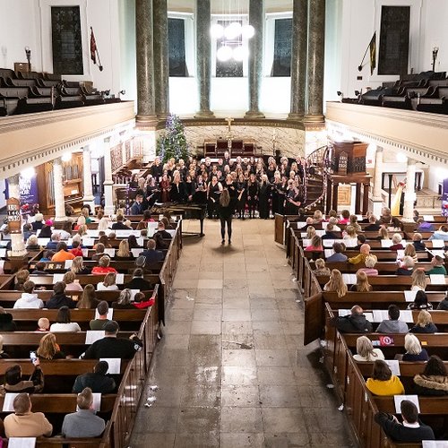 The London Show Choir performs at the Solving Kids' Cancer UK Christmas Carol Concert in 2022.